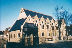 Church rebuilt without steeple, 1996